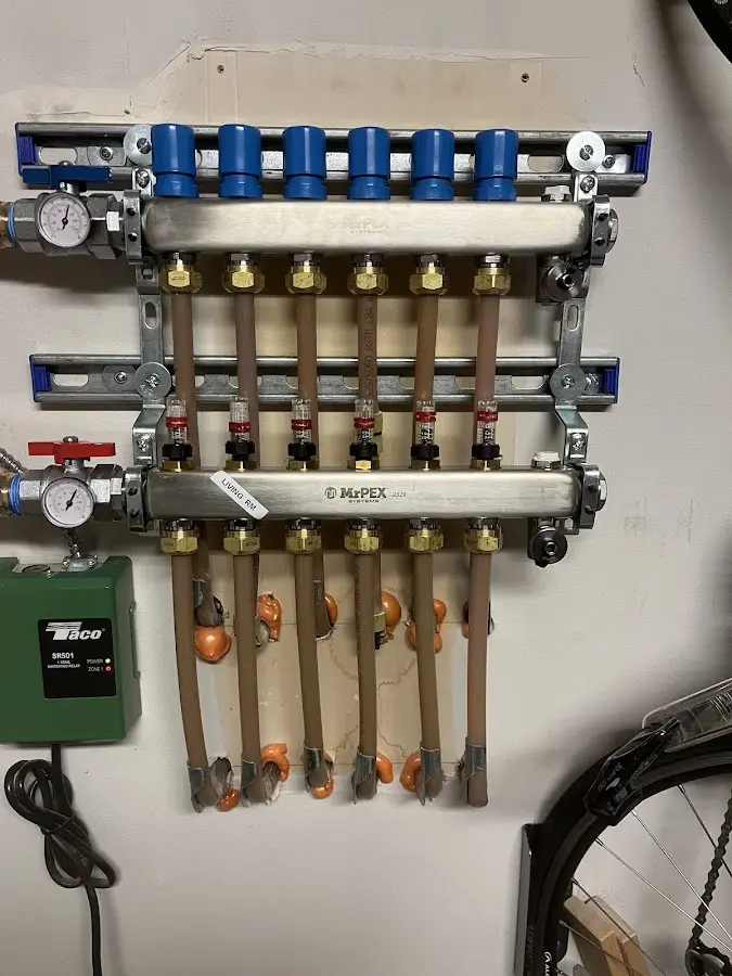 Plumber performing Water Heater Repair at a residential property in Little Chute